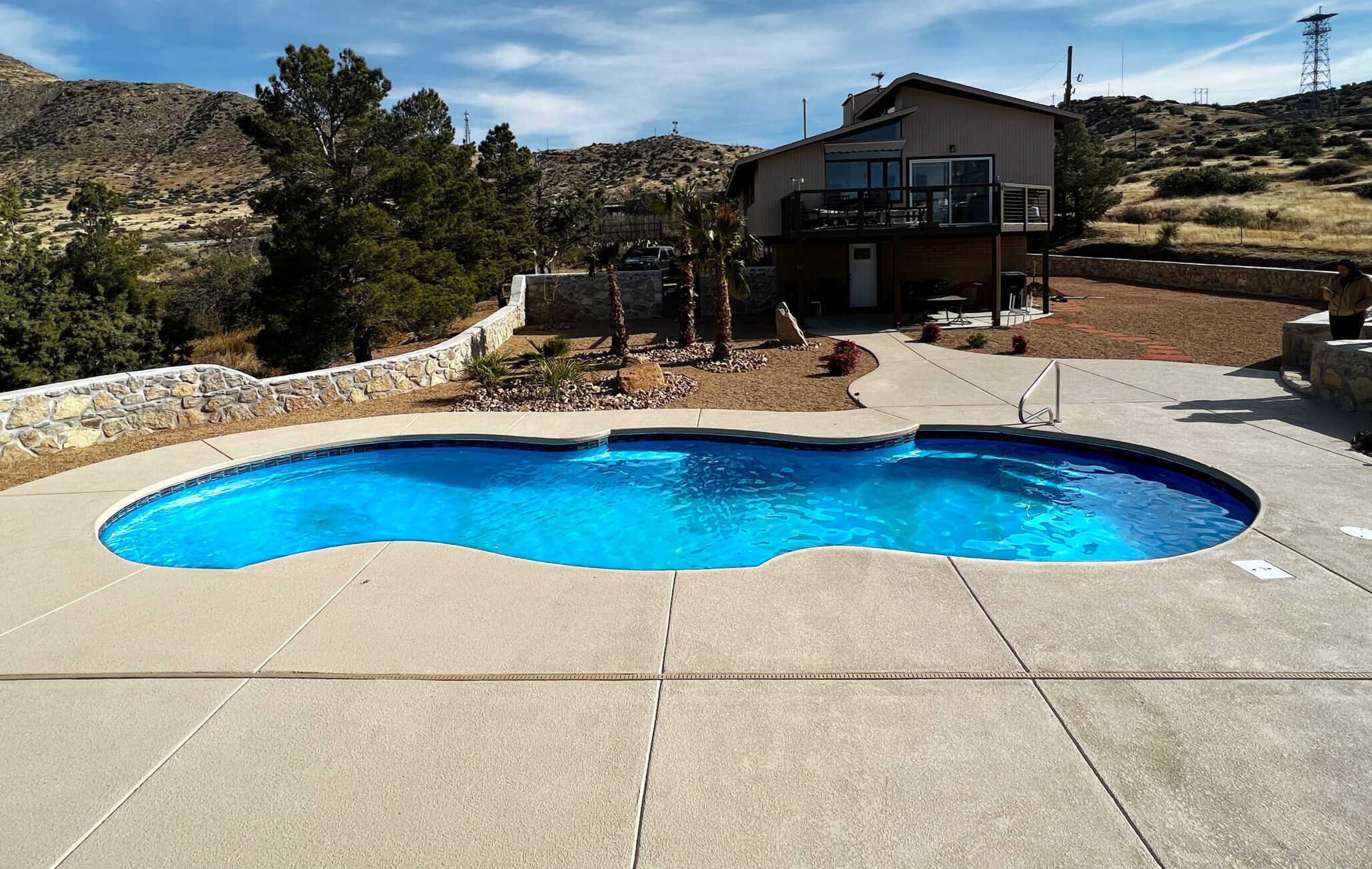 A fully installed fiberglass pool meant to display a finished pool installation.
