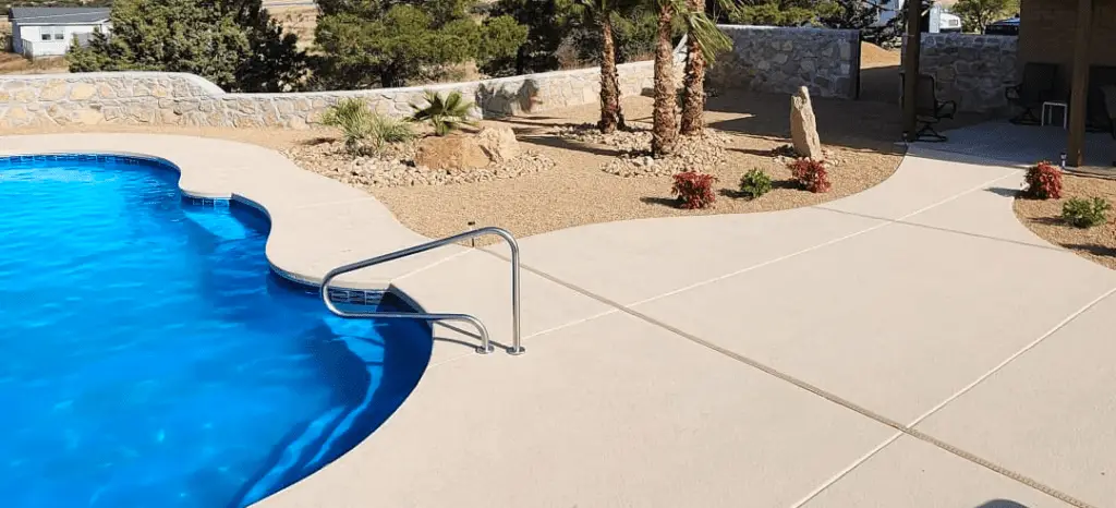 Cool pool deck seen by a San Juan fiberglass pool.