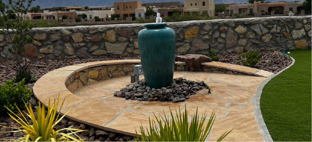 A pondless pots water feature displayed in a backyard.